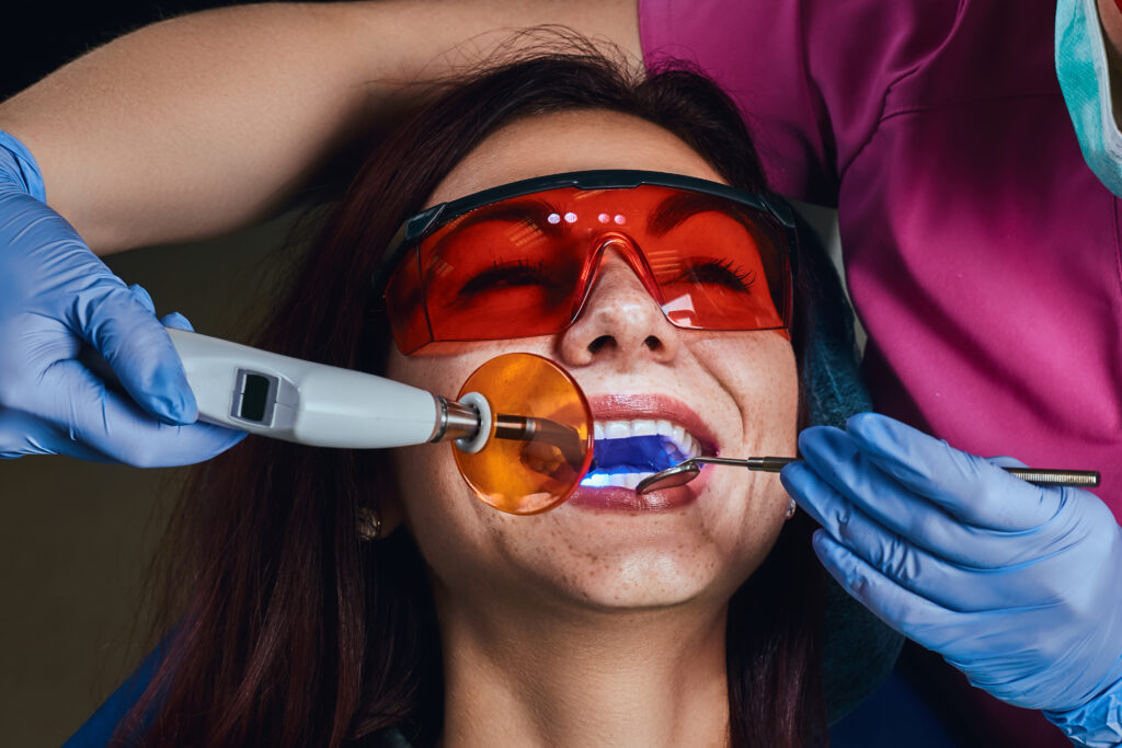 Female dentist treating a patient.